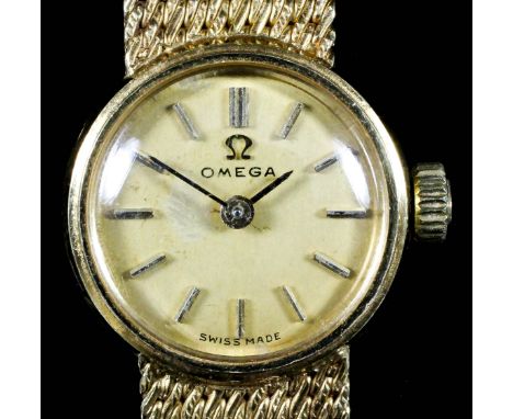 A lady's Omega 18ct gold cased manual wind wristwatch, the gold dial with gold numeral batons, 16mm diameter, with integral M