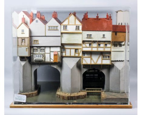 A painted wood cased model of the medieval London Bridge, showing timber framed buildings and a cut away model of a sluice, 2