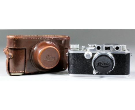 A Leica IIIc camera No. 286204, with 50mm lens No. 349413, in original leather case