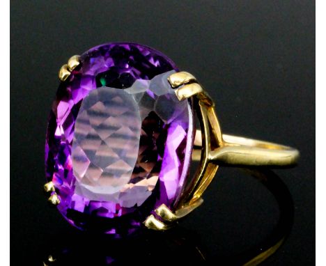 A modern 9ct gold mounted amethyst ring, set with an oval facet cut amethyst (approximate weight  8ct), (size P - gross weigh