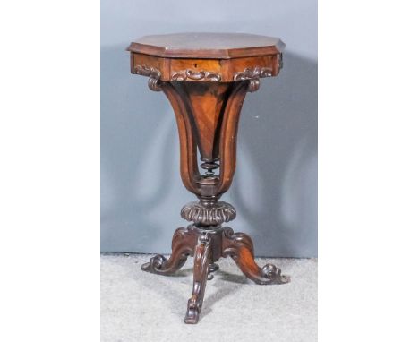 A Victorian rosewood octagonal worktable, the figured veneered lifting top with moulded edge, enclosing fitted interior, the 