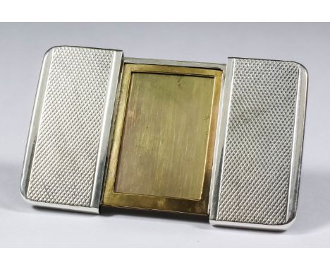 "BARGAIN HUNT" LOT.&nbsp; A French silvery metal portable photograph frame by Dupont of Paris, with engine turned sliding cov