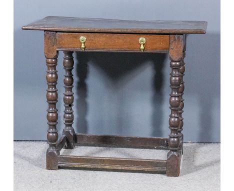 A 17th Century oak rectangular occasional table with moulded edge to top, fitted one frieze drawer, on bobbin turned supports