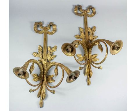 A pair of 20th Century Continental ormolu two-branch wall appliques, the branches modelled as horns, the bracket with oak lea