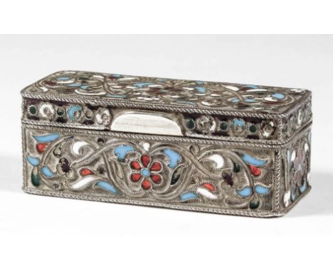 A late 19th Century Russian silvery metal and champleve enamel rectangular box decorated with floral and leaf scroll ornament