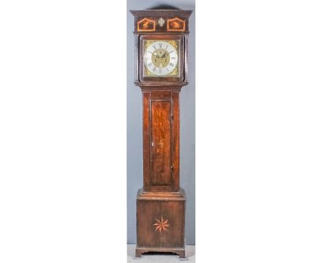 An 18th Century Dutch oak longcase clock by Pieter Klock of Amsterdam, the 12.25ins square brass dial with wide silvered chap