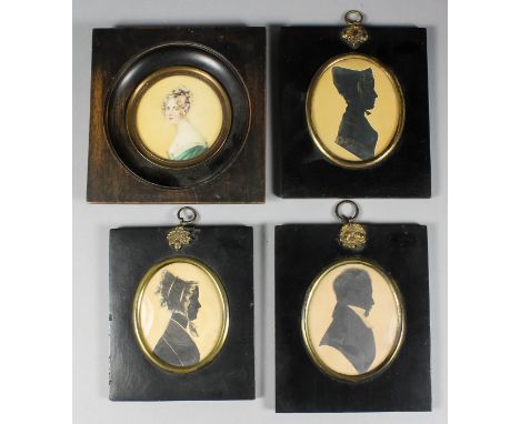 Three early Victorian oval shoulder length silhouettes with gilt highlights, 3.25ins x 2.5ins, in black papier mache rectangu