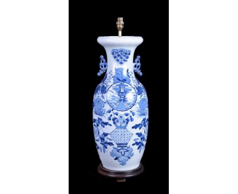 A large Chinese blue and white vase, painted with various flowers, the vase approximately 57cm high, drilled through base and