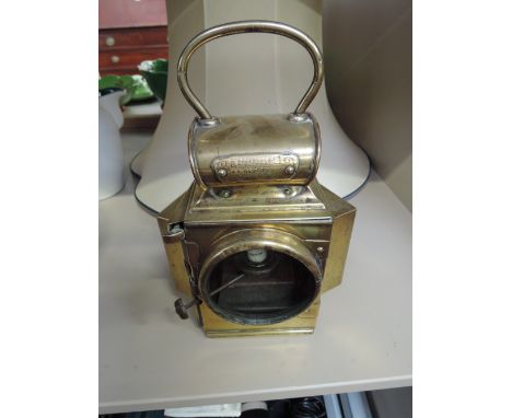 A vintage brass dependence lamp by R Oldfield Ltd, Patent Rd No 425005