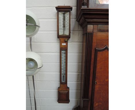 A 19th century mahogany stick barometer by Negretti and Zambra, London, having chamferred scale and thermometer