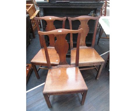 An early 19th century oak commode armchair having rail back and square legs, and three late 18th/early 19th century dining ch