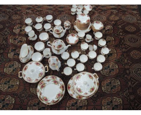 A Royal Doulton dinner and tea service in the Old Country Roses pattern