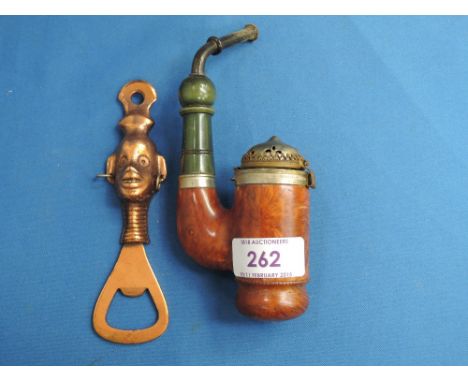 A continental burr wood pipe stamped PWS and a copper ethnic bottle opener