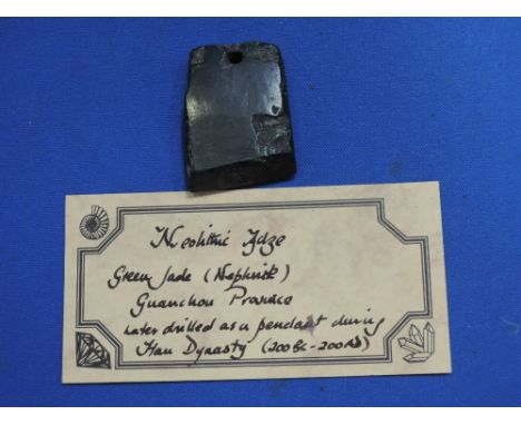 A Neolithic adze, green jade (nephrite), Guanchou Provence, later drilled as a pendant during the Han Dynasty