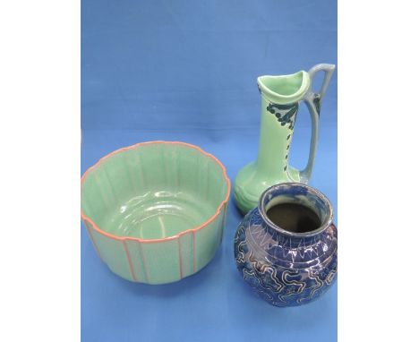 An Austrian jugendstil jug, a Poole Pottery jardinere and a Burmantofts vase of bulbous design having scraffigo decoration