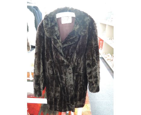 A 1950's/60's Capstick & Hammer chocolate brown pedigree moleskin coat with satin lining