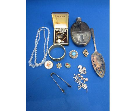 A small selection of costume jewellery and plated ware including a hip flask, cake slice, diamante, crystal beads, brooches, 