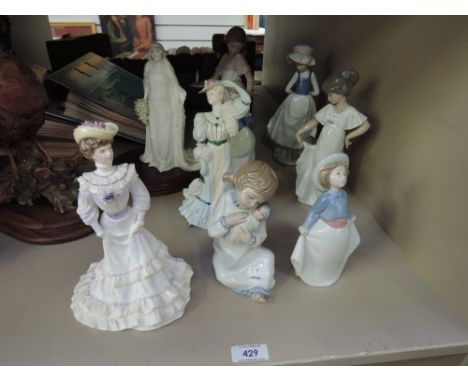 Nine decorative figurines including Nao and Coalport