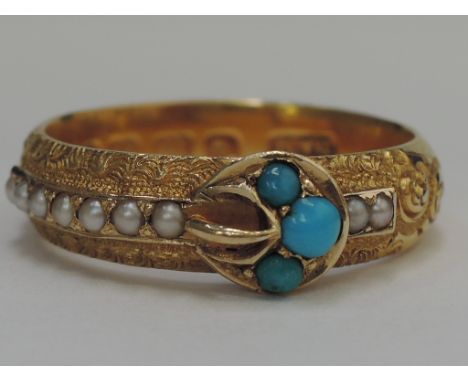 A ladies 18ct gold dress ring modelled as a belt with seed pearl and scroll decoration and turquoise detail to buckle