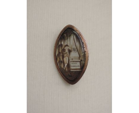 An 18th century mourning brooch within a lozenge shaped yellow metal mount having a painted enamel plaque depicting a gentlem