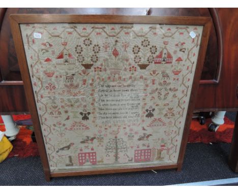 A Victorian tapestry sampler, in a floral/ naturalistic style having script for Ann Lumb 1841