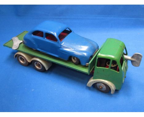 A Shackleton clockwork Foden flat truck, having green body and cab and a Chad Valley clockwork Sedan car in blue