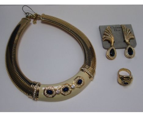 A 1980's necklace by Christian Dior having a central 'cream enamel panel with blue paste and diamante decoration on a snake l