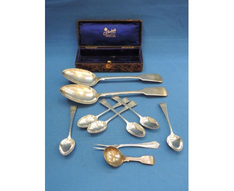 A pair of Georgian silver table spoons of fiddle pattern, London 1836, makers marks worn, a silver caddy spoon, Birmingham 18