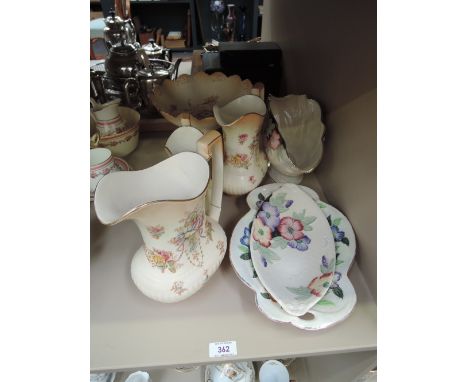 A Fieldings Crown Devon jug trio and tazza, a Maling vase and two similar dishes in floral lustre pattern