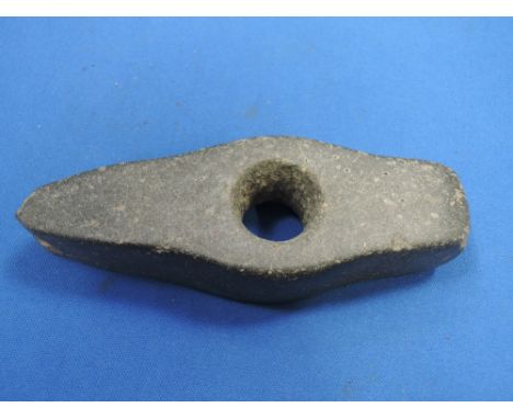 An axe-hammer, possibly horneblende or diorite, found on Skelton Moor 