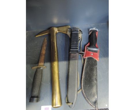 A selection of militaria including a late 20th century sub machine style bayonet, a brass axe ornament etc