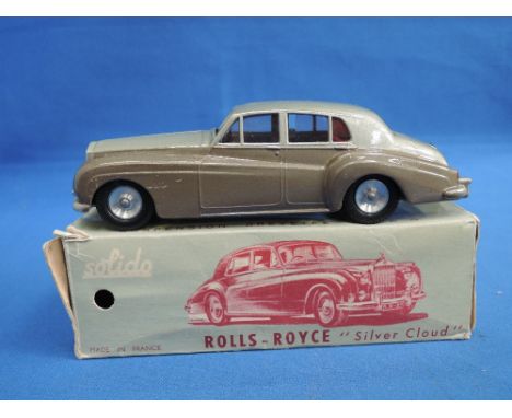 A Solido die-cast, Rolls Royce Silver Cloud, two tone grey with red interior, in original box 115