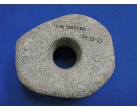 A Neolithic perforated stone hammer head, found Chysauster, near Penzance