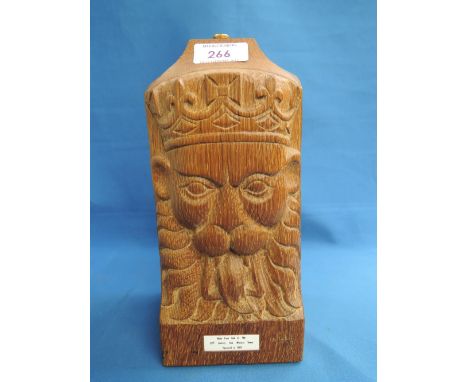 An oak table lamp base with plaque made from the 15th century York Minster Tower, restored in 1969, having Regal Lion decorat