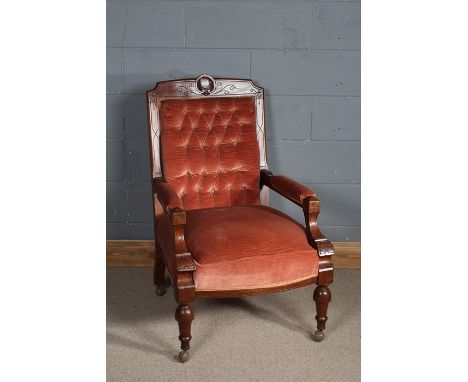 Late Victorian open armed arm chair with a shell motif to the top, upholstered in pink fabric and button backed  