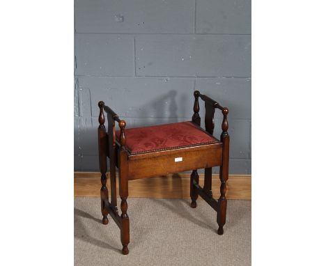 Early 20th Century mahogany piano stool, with upholstered lift up seat, slatted sides and spindled legs, 54cm wide