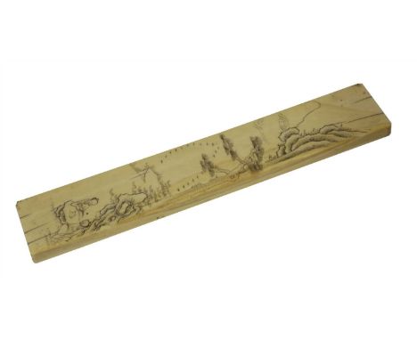 A Chinese ivory scroll weight, 19th century, incised with literati seated by a rock under a pine tree in a rocky landscape, 2