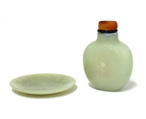 A Chinese jade snuff bottle, Qing dynasty (1644-1911), of ovoid form, the stone of pale celadon tone, 5cm, and a snuff dish, 