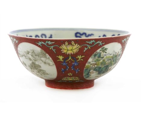 A Chinese famille rose bowl, Daoguang (1821-1850), of circular form on a circular foot, painted with a landscape of four seas
