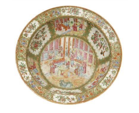 A Chinese Canton enamelled famille rose basin, 19th century, painted with figures, birds and flowers in shaped panels amongst