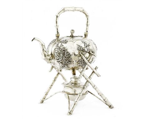 A Chinese silver spirit kettle, c.1900, of lobed globular form decorated with birds and flowers in relief, the handle, spout 