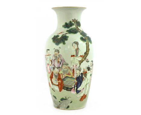 A Chinese famille rose vase, 18th century, of baluster form, painted with the Eight Daoist Immortals gathering under a pine t