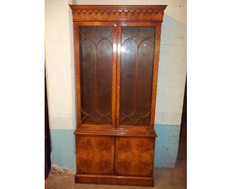 A VINTAGE BURR GLAZED BOOKCASE DRESSER