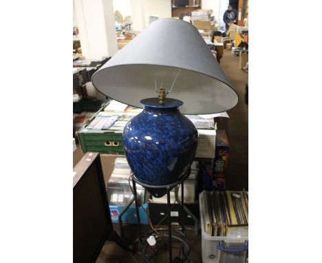 A LARGE CERAMIC LAMP WITH SHADE