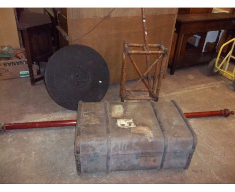 AN ANTIQUE WOOD BOUND TRAVEL TRUNK WITH SEVERAL TRAVEL LABELS ATTACHED, AN ANTIQUE WOODEN UMBRELLA/STICK STAND AND A CARVED E