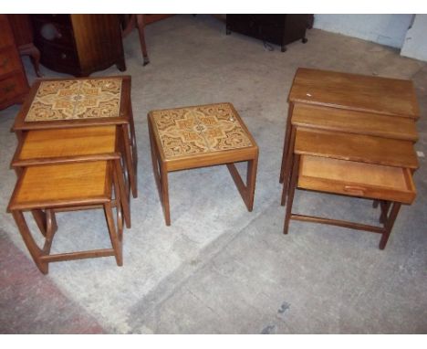 A RETRO TEAK NEST OF THREE TABLES WITH DRAWER AND A NEST OF TILE TOPPED TABLES WITH AN EXTRA OCCASIONAL TILE TOPPED TABLE