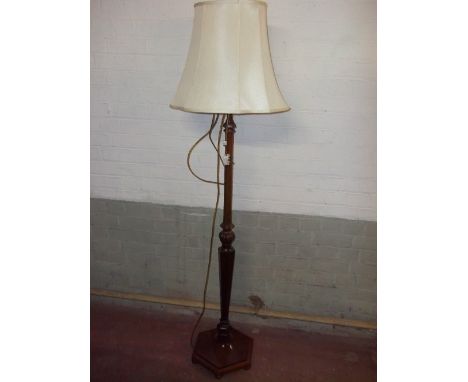 A FLOOR STANDING STANDARD LAMP
