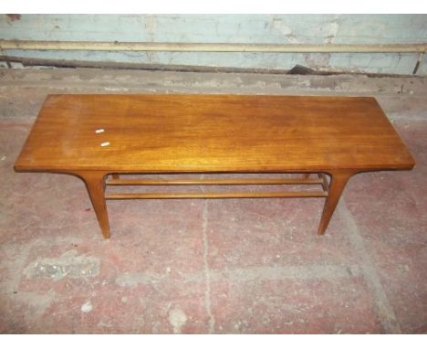 A TEAK LONG JOHN STYLE COFFEE TABLE WITH STRETCHER SHELF