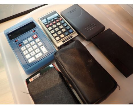 Seven assorted vintage calculators including Bohn Commodore Sharp and Texas Instruments 