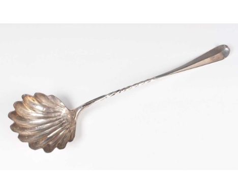 A mid-18th century Scottish silver Hanoverian pattern soup ladle with scallop shell bowl and spiral twisted handle, crest eng